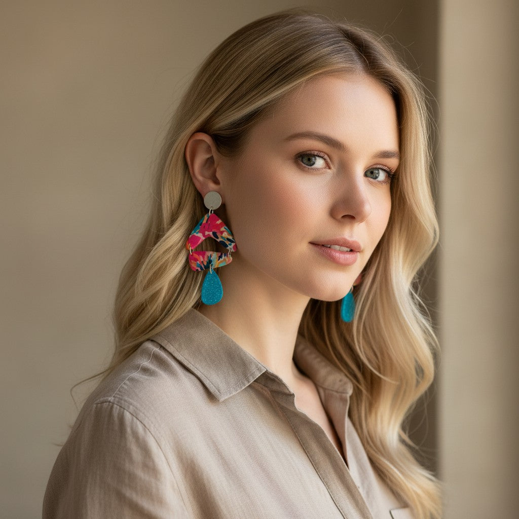 Lakelynns Designs Wrenlee Abstract Pattern Dangle Earrings with fuchsia, teal, orange, navy blue watercolor design and blue teardrop.