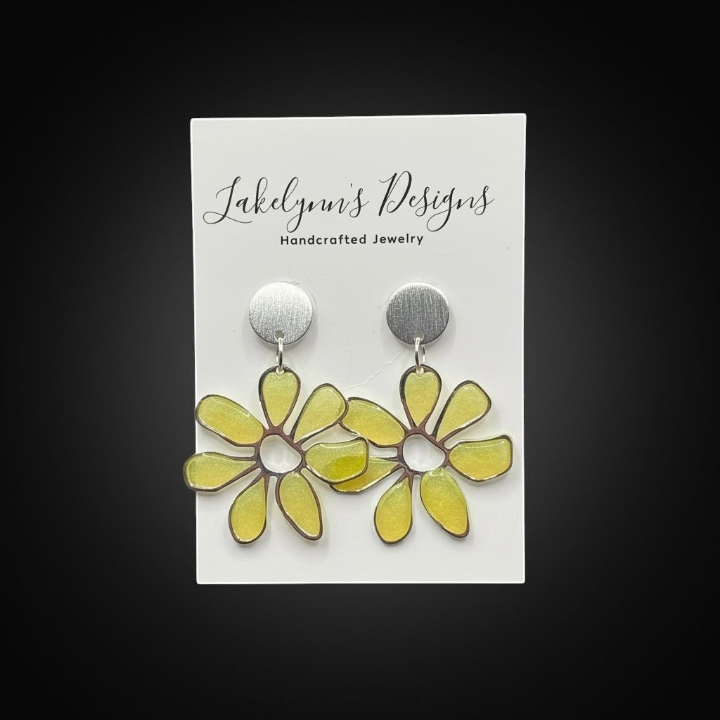 Lakelynns Designs yellow daisy floral statement earrings with translucent petals and brushed silver-tone discs.