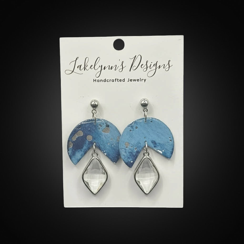 Lakelynns Designs Zaylee Dangle Earrings: Blue marbled geometric design with clear faceted gemstone.